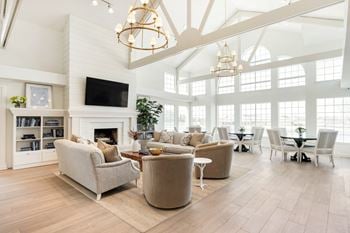 A living room with a fireplace and a television